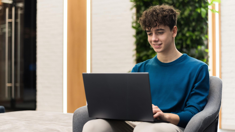 student wearing a blue shirt - Best AI Essay Writer For Students