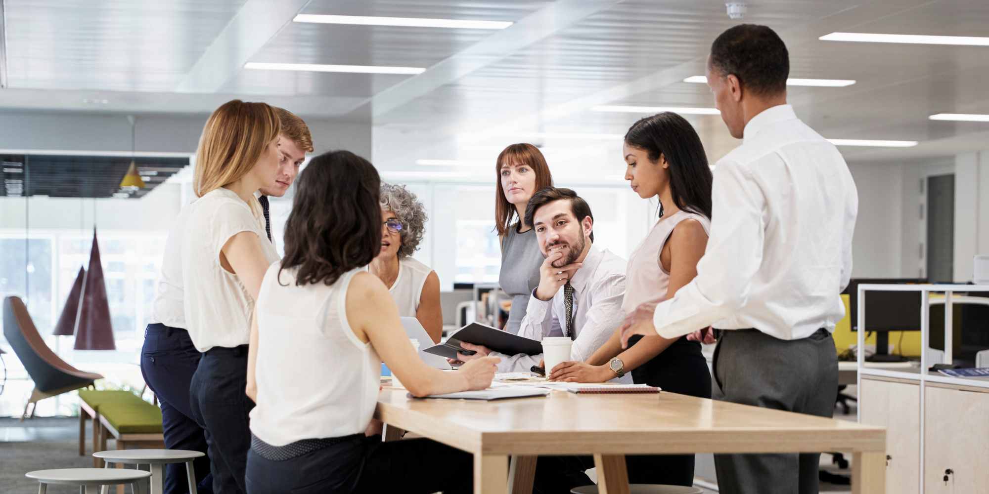 employees in an office - Benefits of Automation in the Workplace