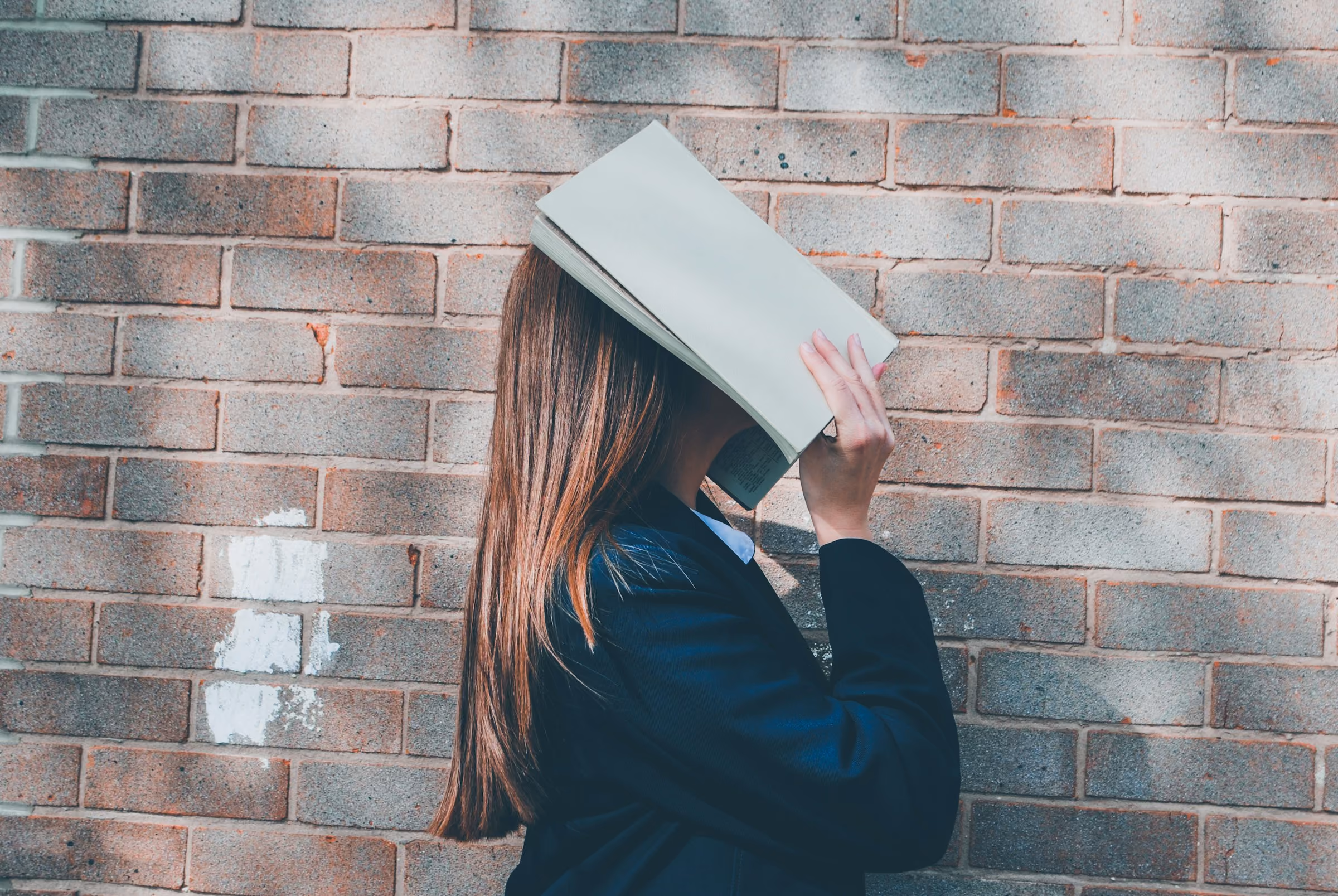 Girl Holding Book - How to Study the Night Before an Exam