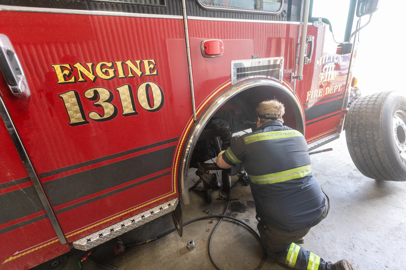 Mechanic performing fire truck repair services n Janesville, WI