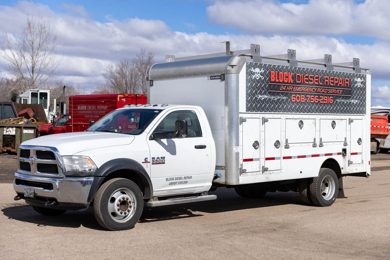 Diesel mechanic performing emergency roadside assistance in Janesville, WI