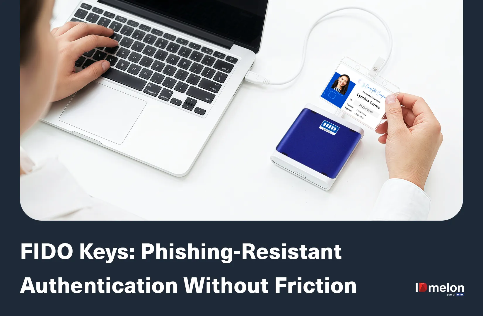 An employee using a laptop and an HID card reader to authenticate with a FIDO security key badge.