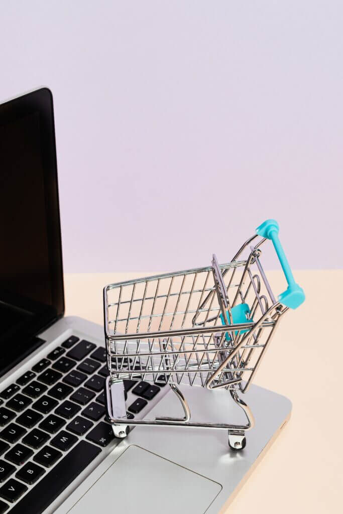 a laptop and a shopping cart