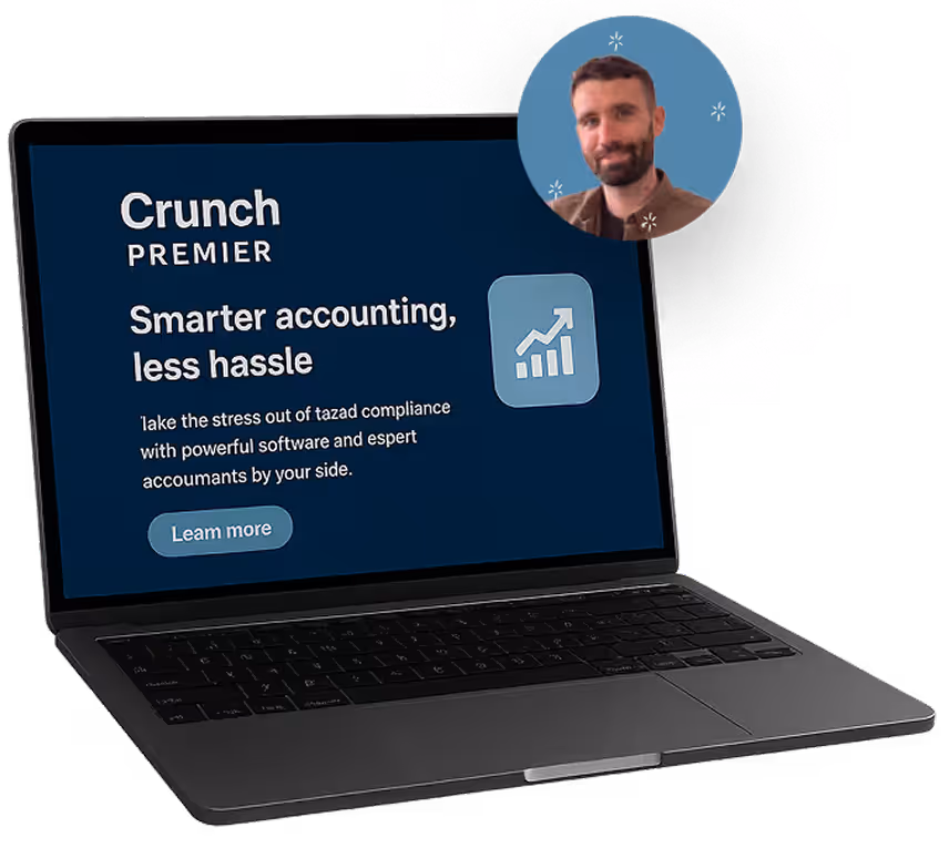 Open laptop displaying Crunch Premier accounting ad offering smarter accounting and less hassle.