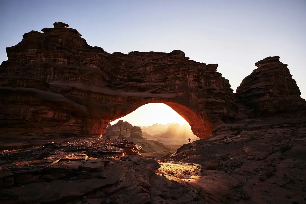A rock arch at sunset