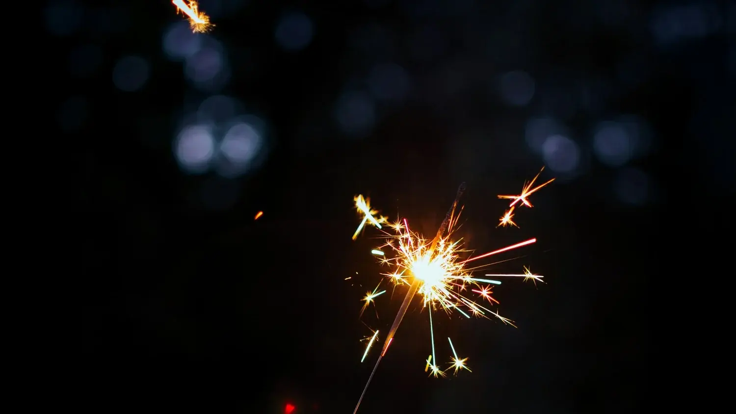 A sparkler burning in the dark