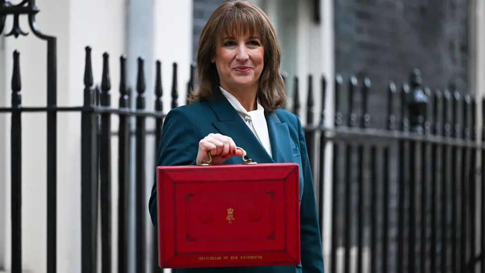 The Chancellor holding up the red Budget box on Downing Street