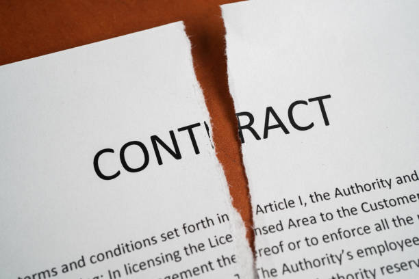 Paper contract torn in half