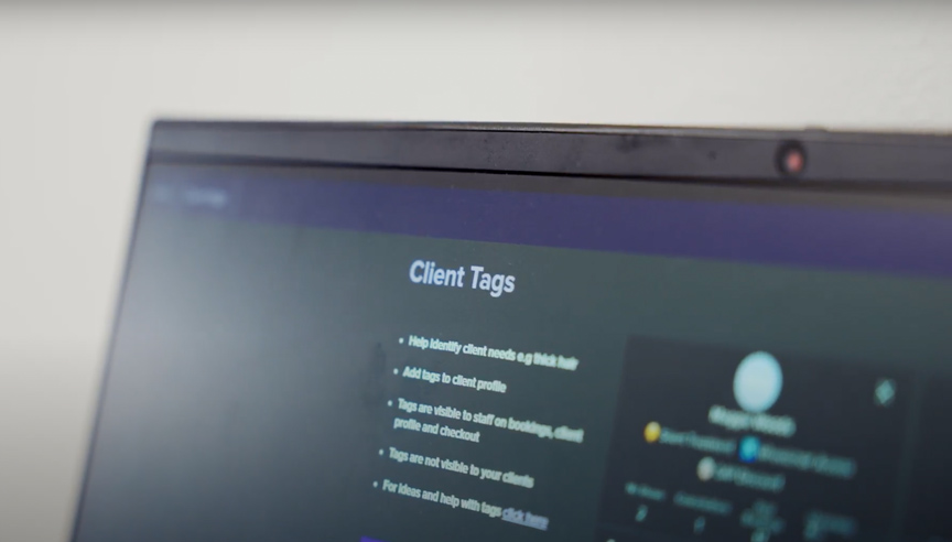 Laptop screen showing the Client Tags feature in Slick