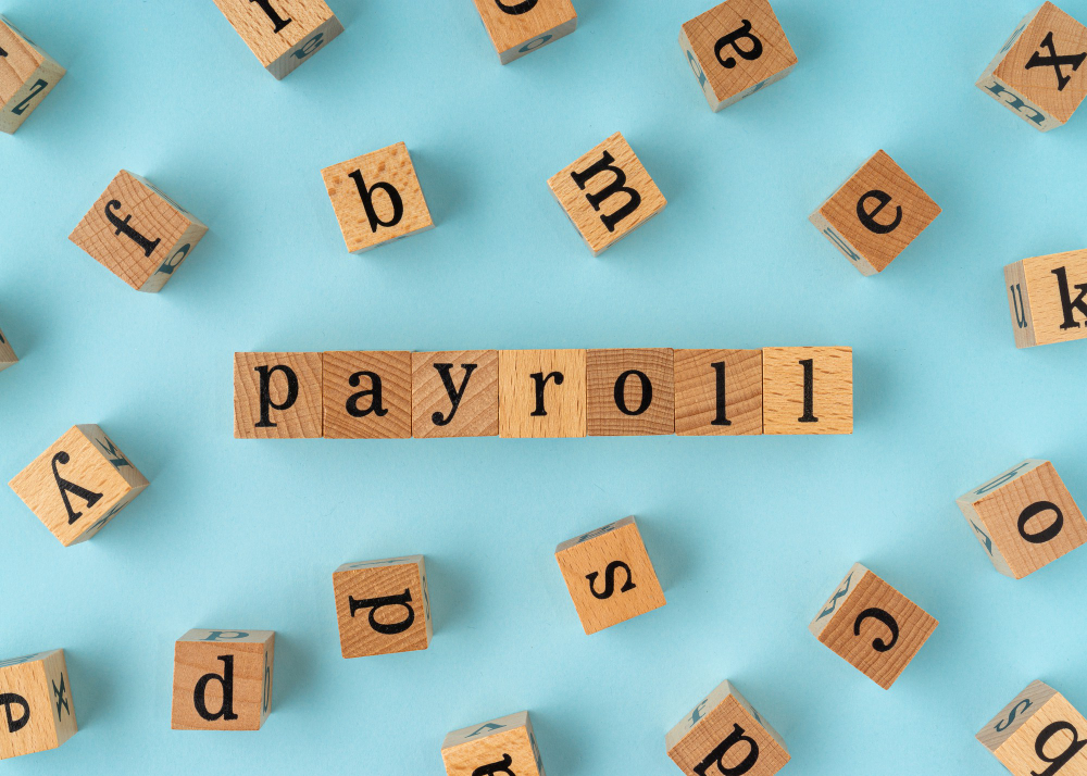 payroll on wooden blocks