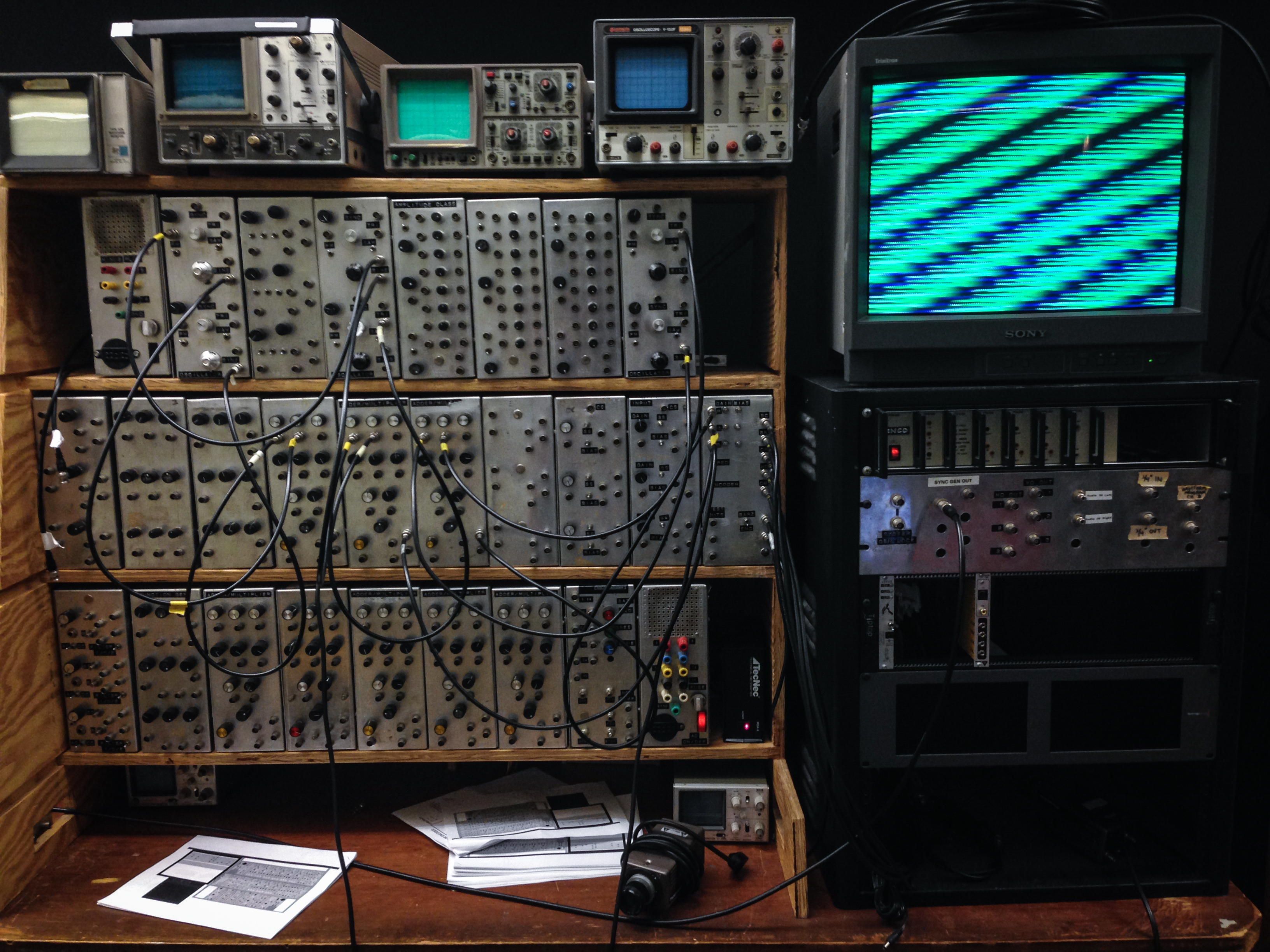 A Sandin Image Processor, a wall of dials and patch cables