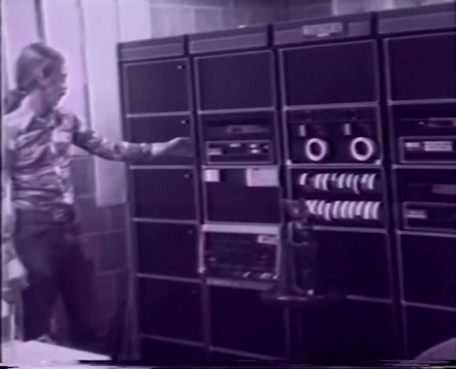Tom DeFanti showing the lab's computer racks