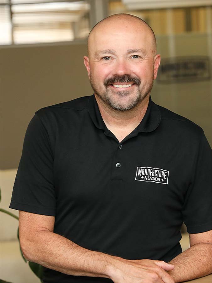 A headshot of manufacturing business advisor Wayne Thompson