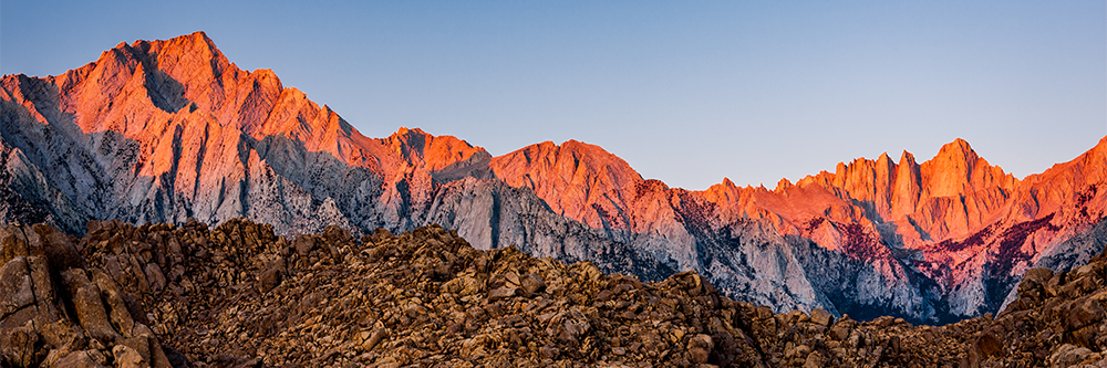 Nevada mountains at sunset, with a blue sky in the background