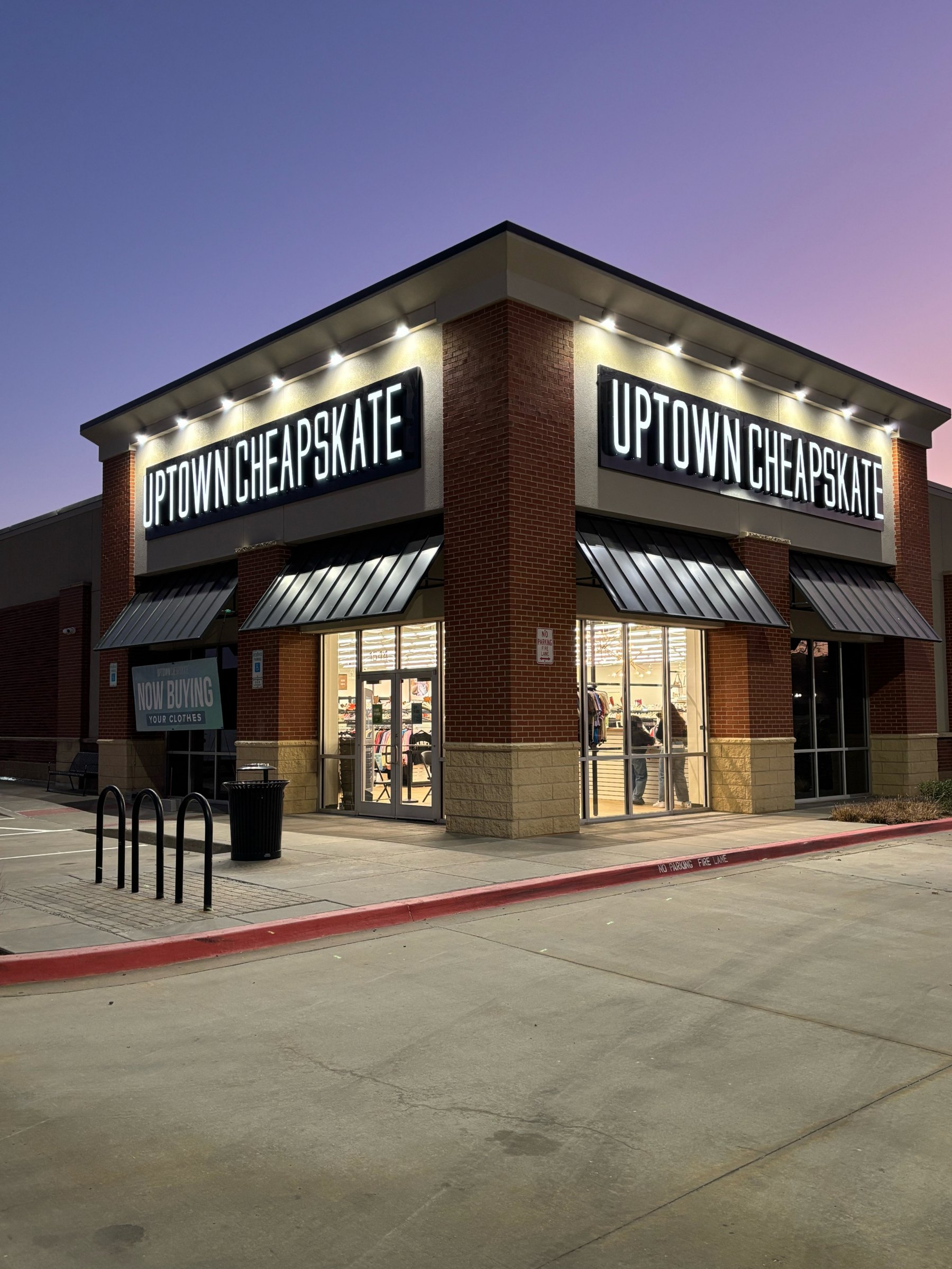 Illuminated channel letters at dusk on the Uptown Cheapskate storefront in Oklahoma City