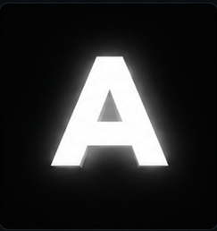 Front-lit channel letter A photographed at night, face illuminated