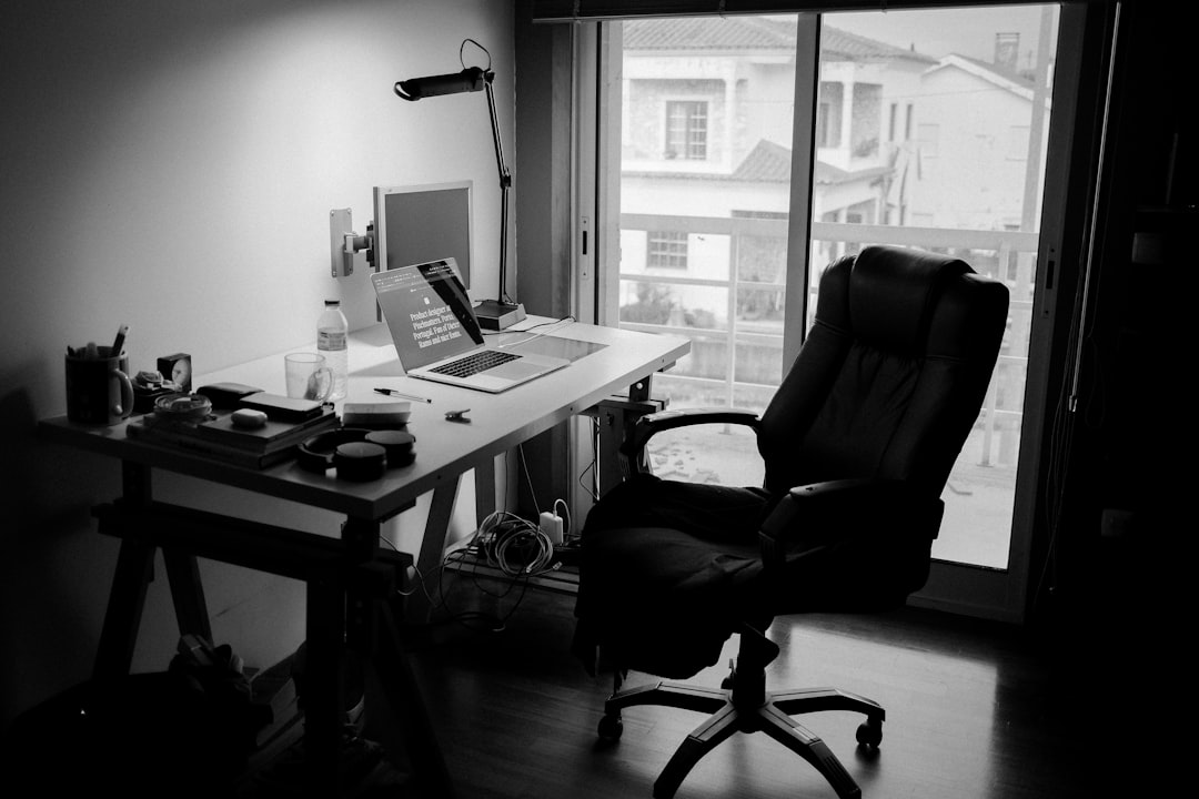 A modern AI agency workspace with financial charts and a laptop showing cash flow forecasting software, representing smart cash flow management.