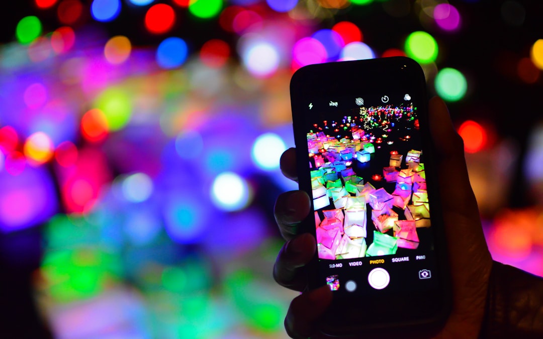 A professional social media agency valuation dashboard on a laptop screen, showing key financial metrics and graphs, in a modern agency office setting.