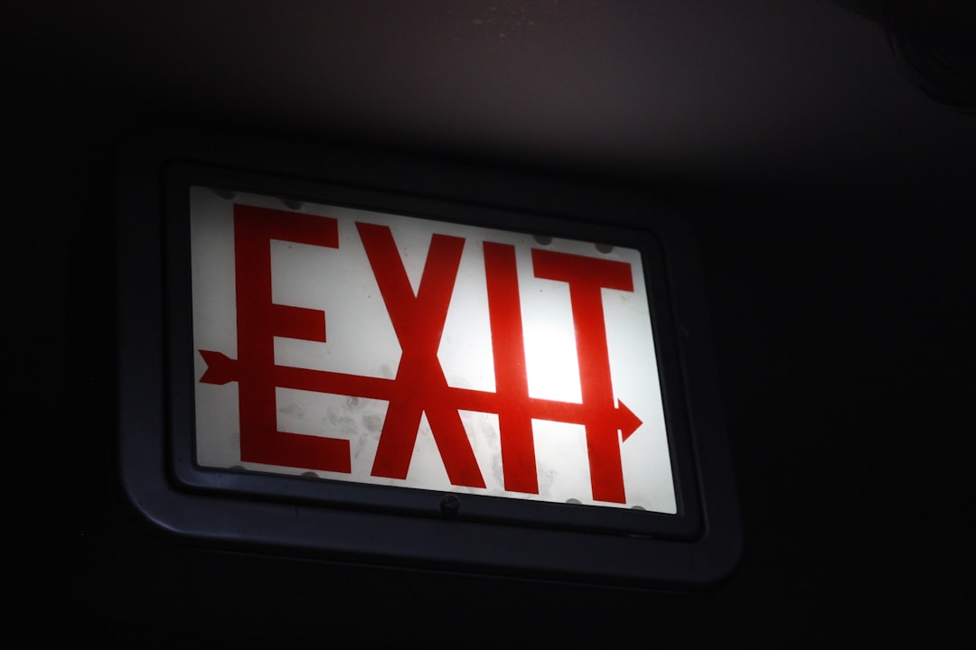 A professional digital marketing agency office scene illustrating exit strategy planning, with financial charts and documents on a modern desk.