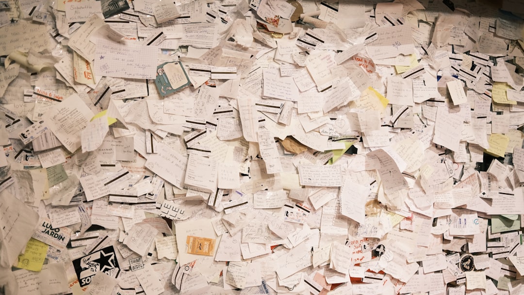 A modern agency workspace with a laptop showing an expense management dashboard, a coffee cup, and receipts neatly organised, representing simple financial systems.