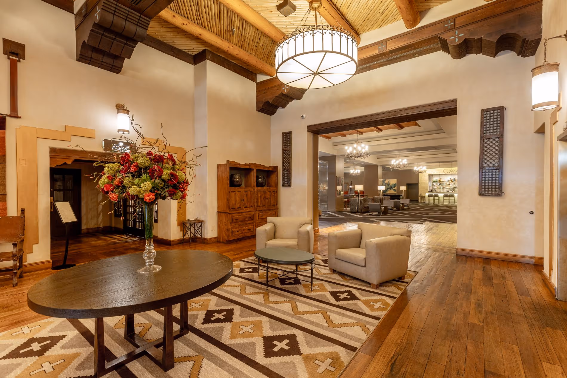 Eldorado lobby with wood floors southwest style rug and furniture