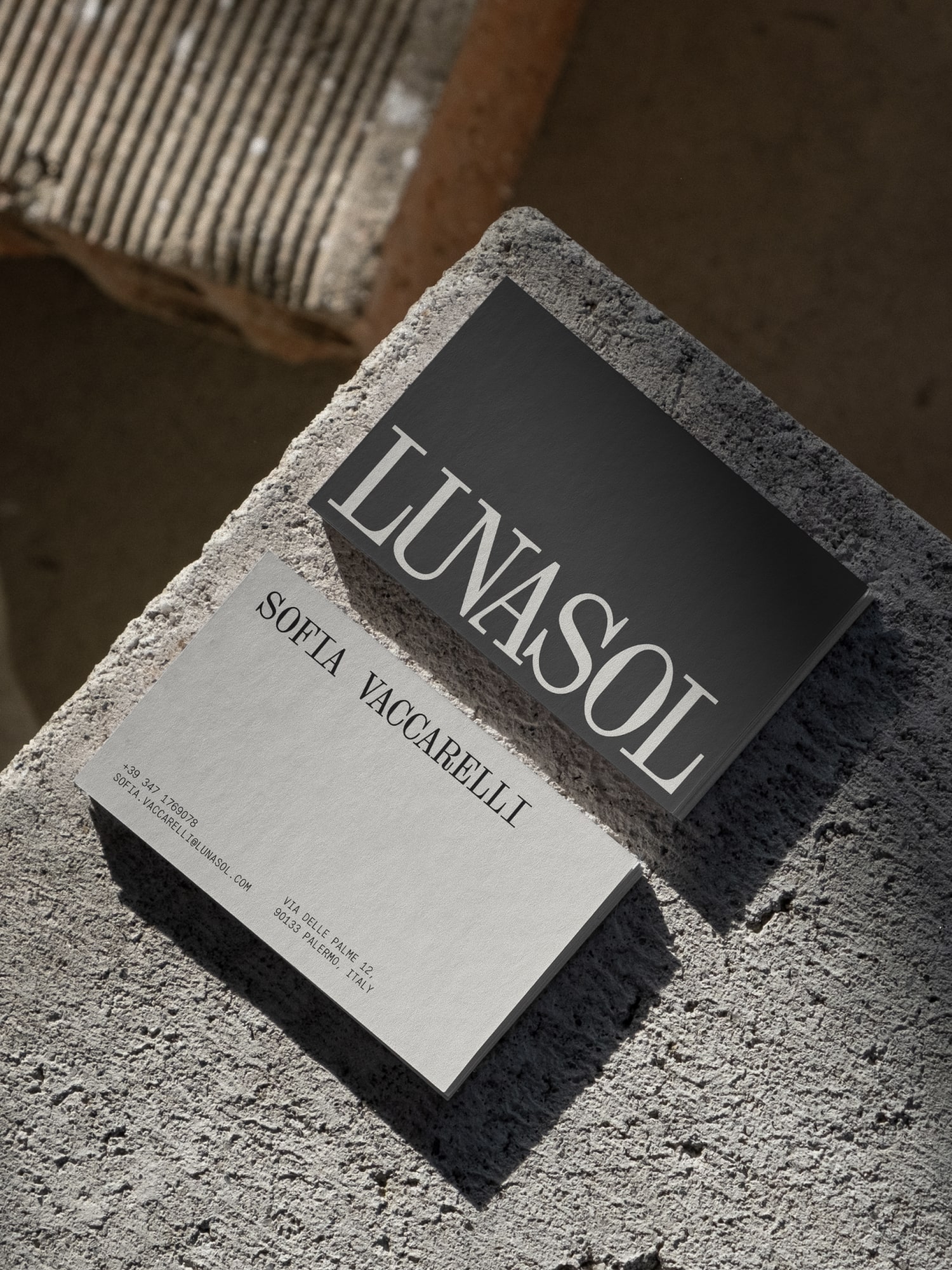 A stack of business cards laying on the brick