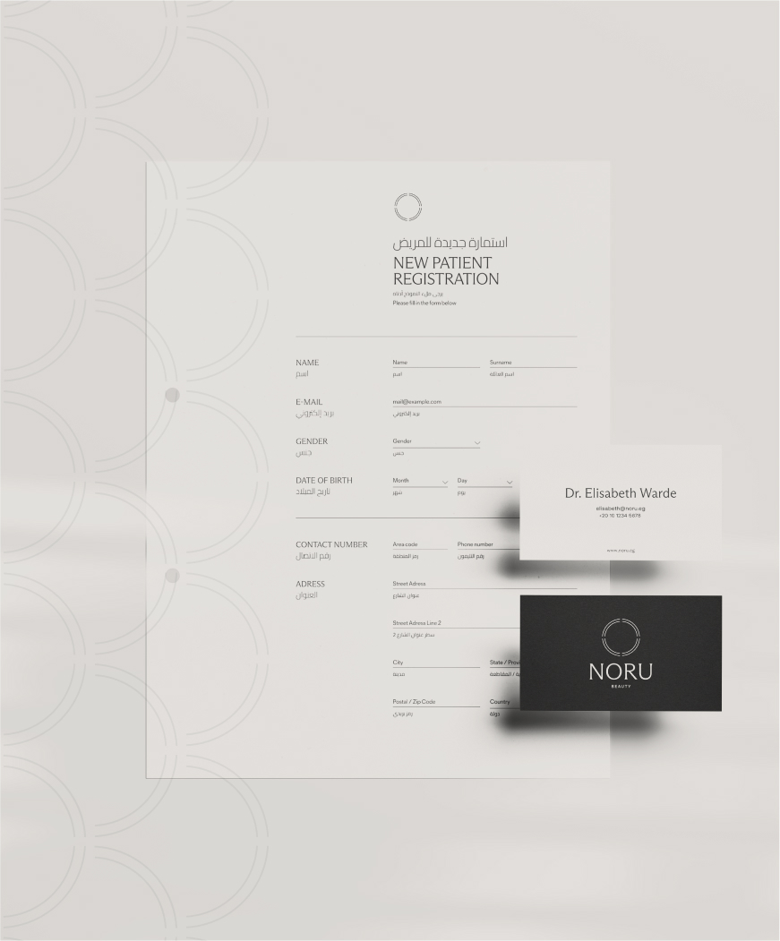 A composition of stationary materials including a business card and registration form