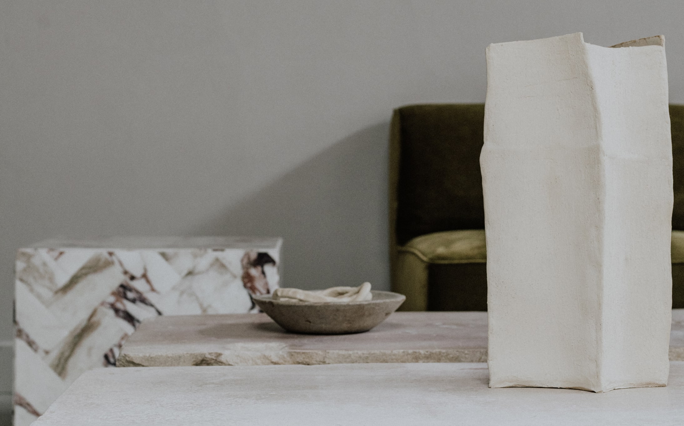 A composition of vase, plate and other objects