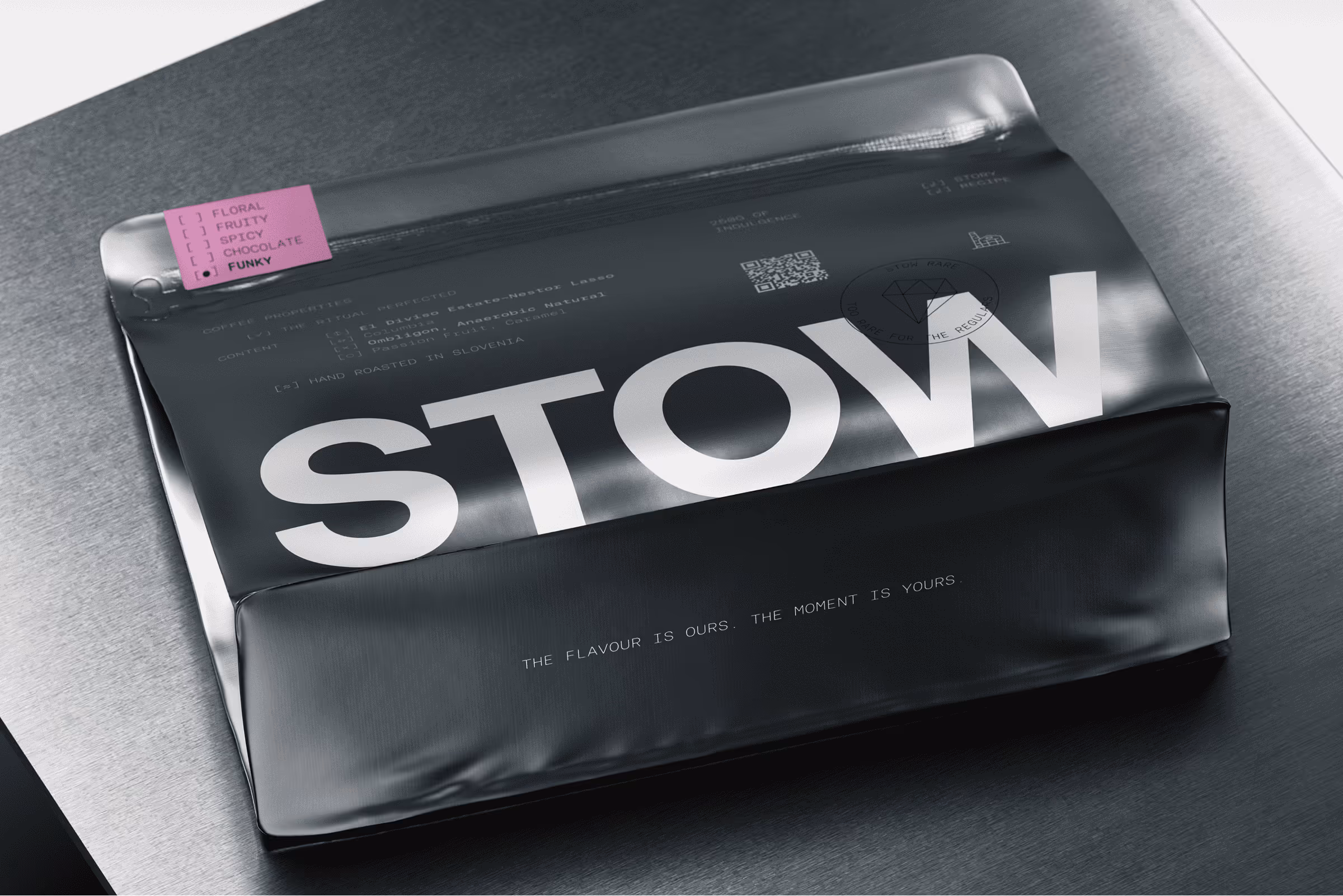Black coffee bag labeled STOW with flavor options checked for funky, placed on a metal surface.