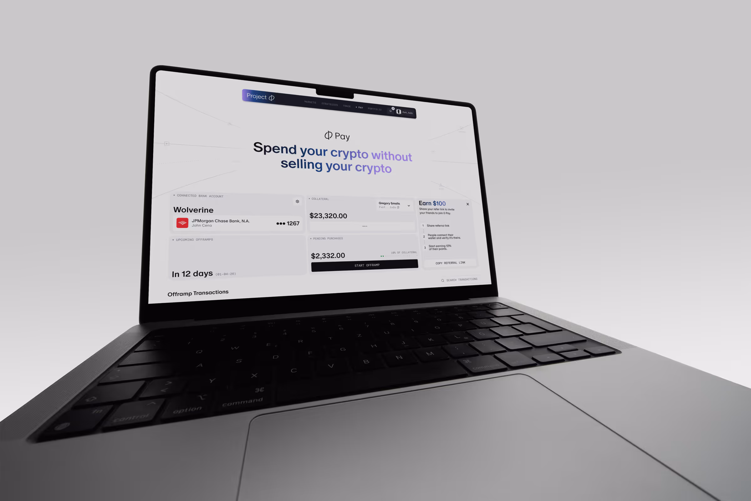 Laptop displaying a crypto dashboard for Project ɸ Pay with account balances and referral info.