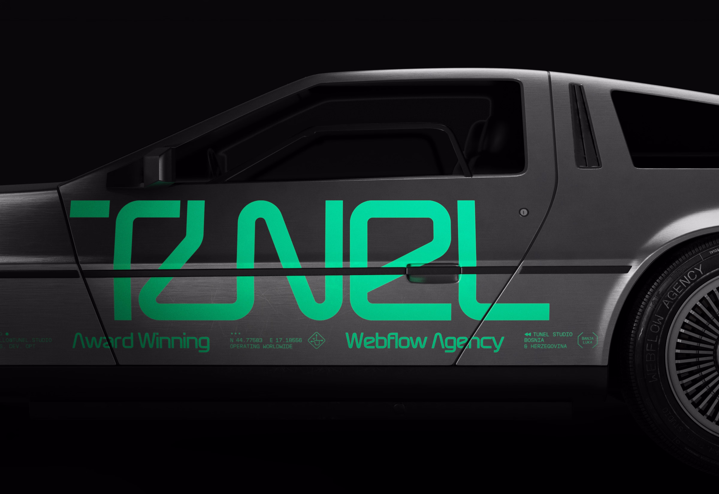Side view of a silver car with green text saying Tunel Award Winning Webflow Agency.