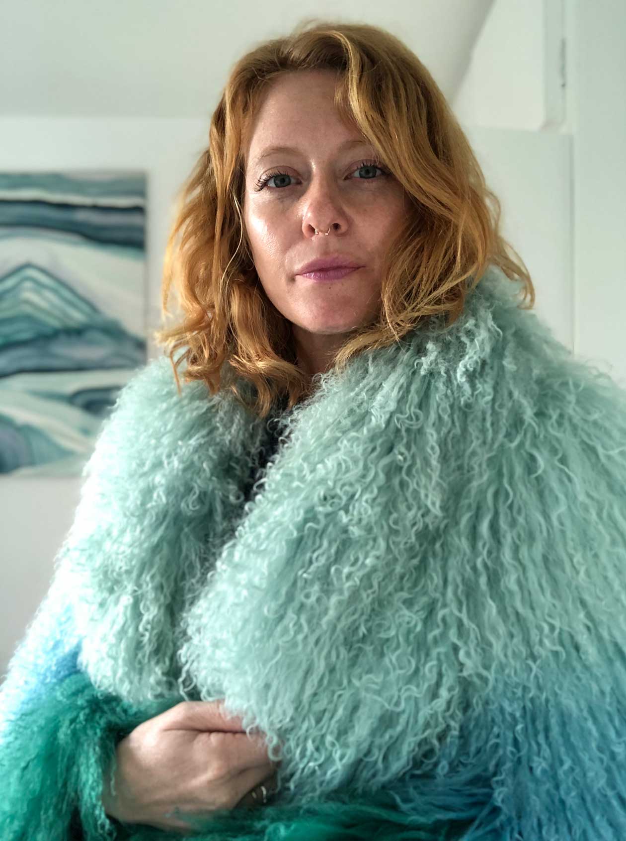 Morgan Ræ headshot - dip dyed teal coat