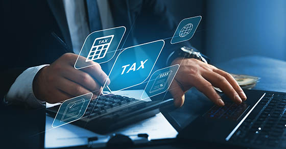 Business professionals reviewing updated payroll tax reporting rules and compliance forms under the One Big Beautiful Bill Act in an office setting