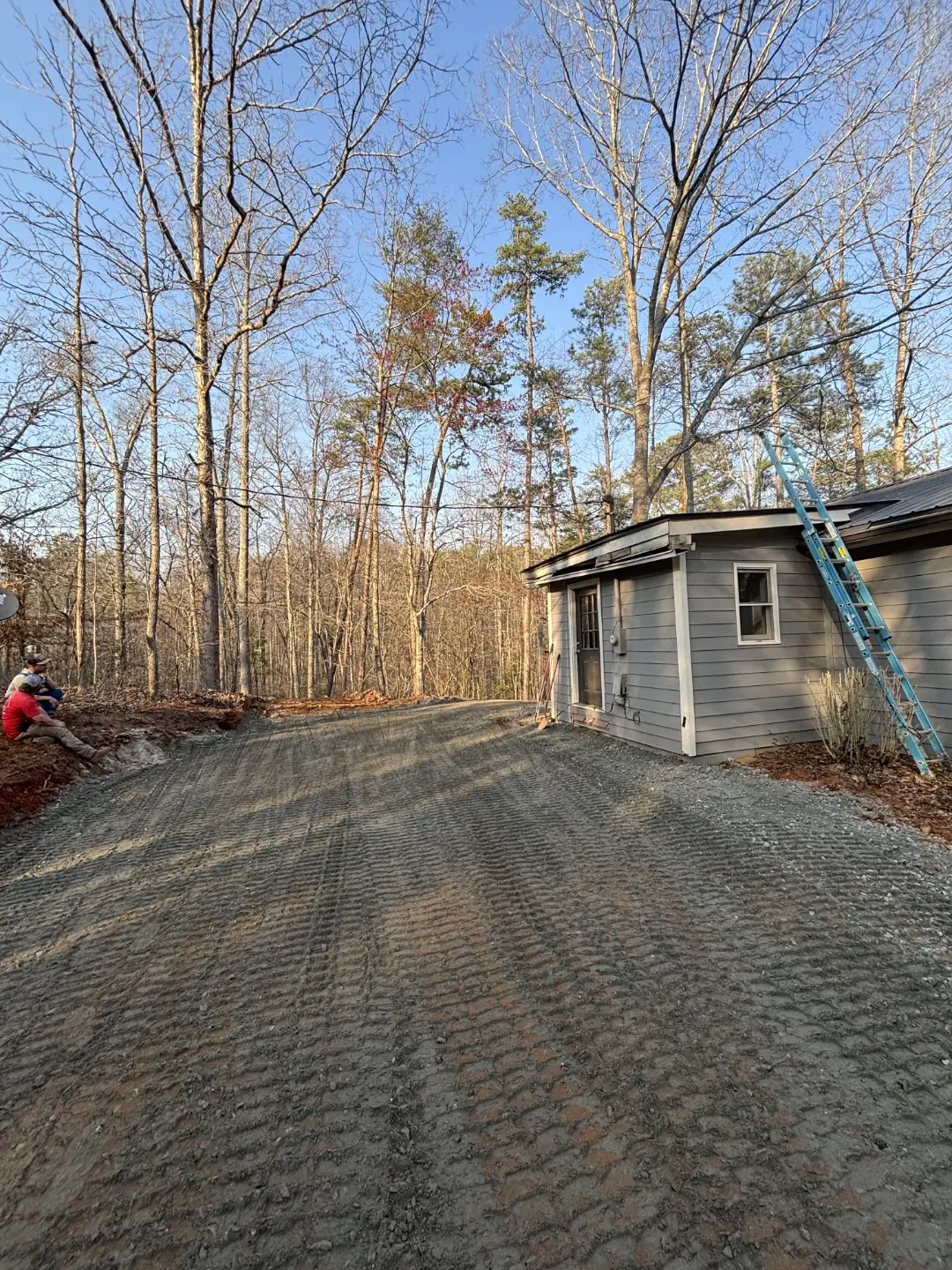 Gravel driveway laid out after fresh grade