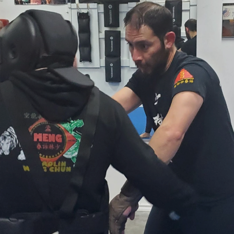 Grand Master Benny Meng talking to students