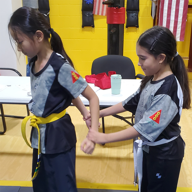 Vincent Meng with palms together