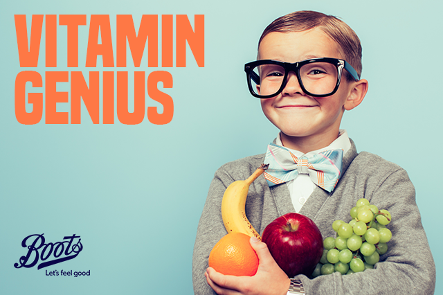 A young boy holding fruit, titled: ‘Vitamin Genius’.