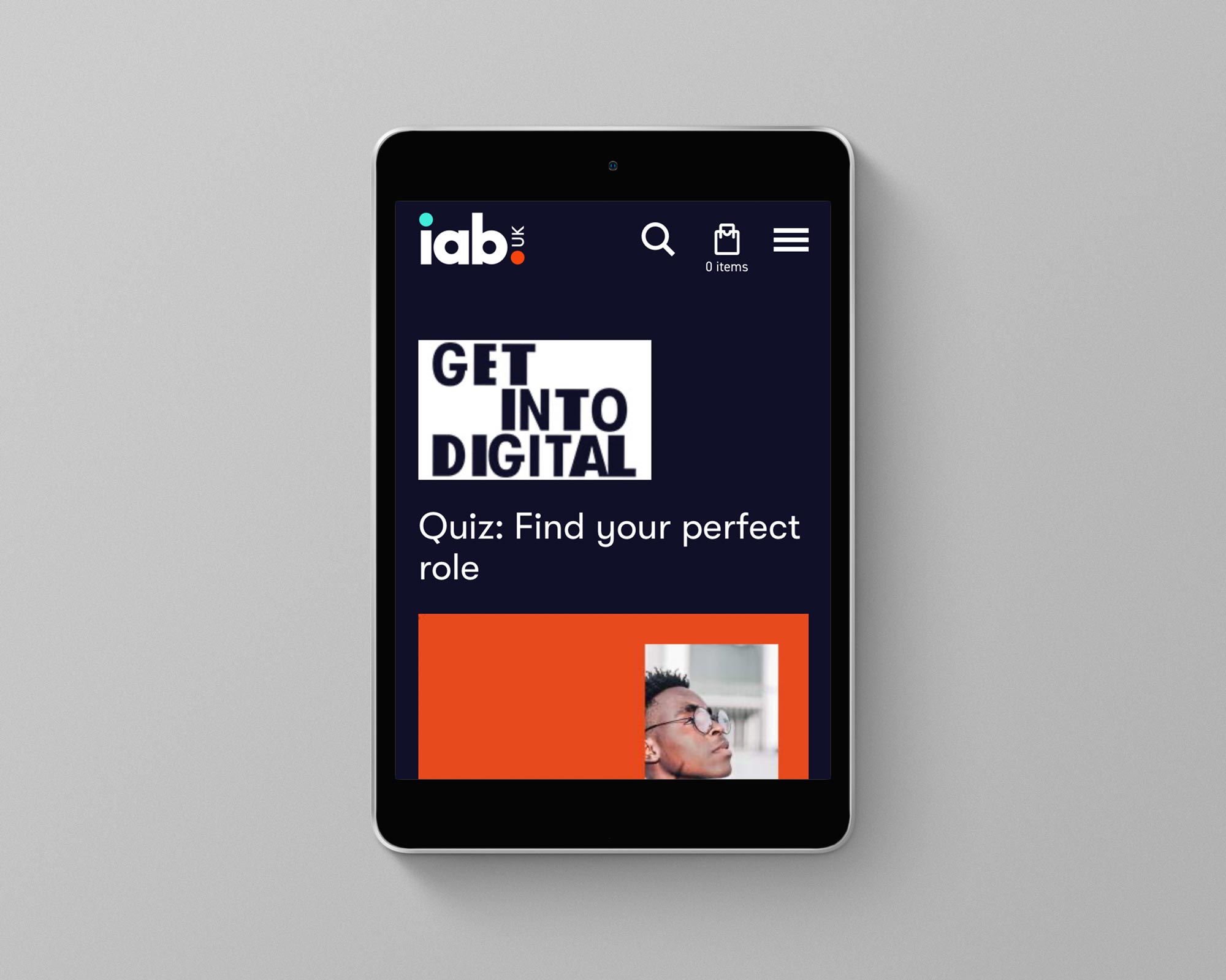 A tablet device displaying an article from the company IAB, promoting careers into digital advertising.