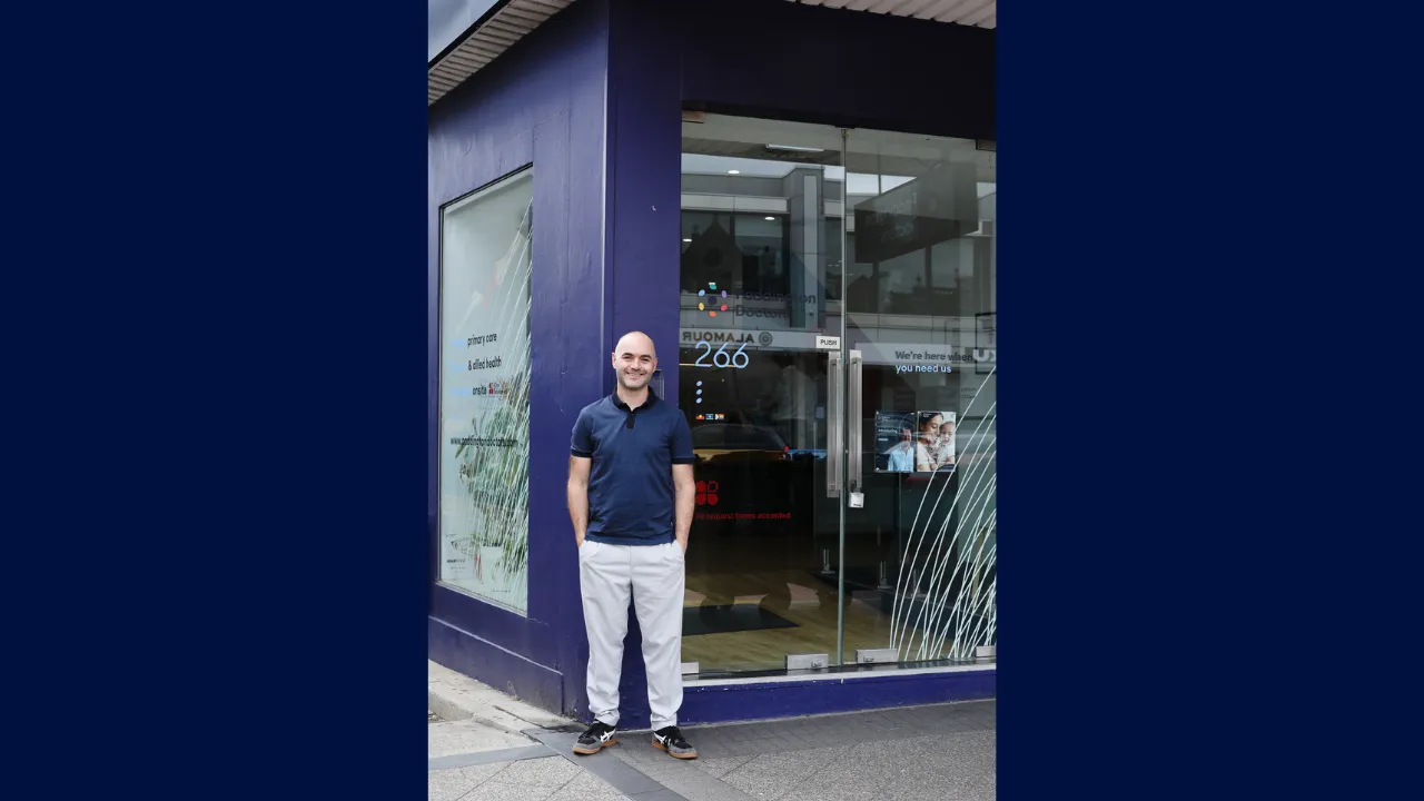 Dr Simon standing in front of the clinic