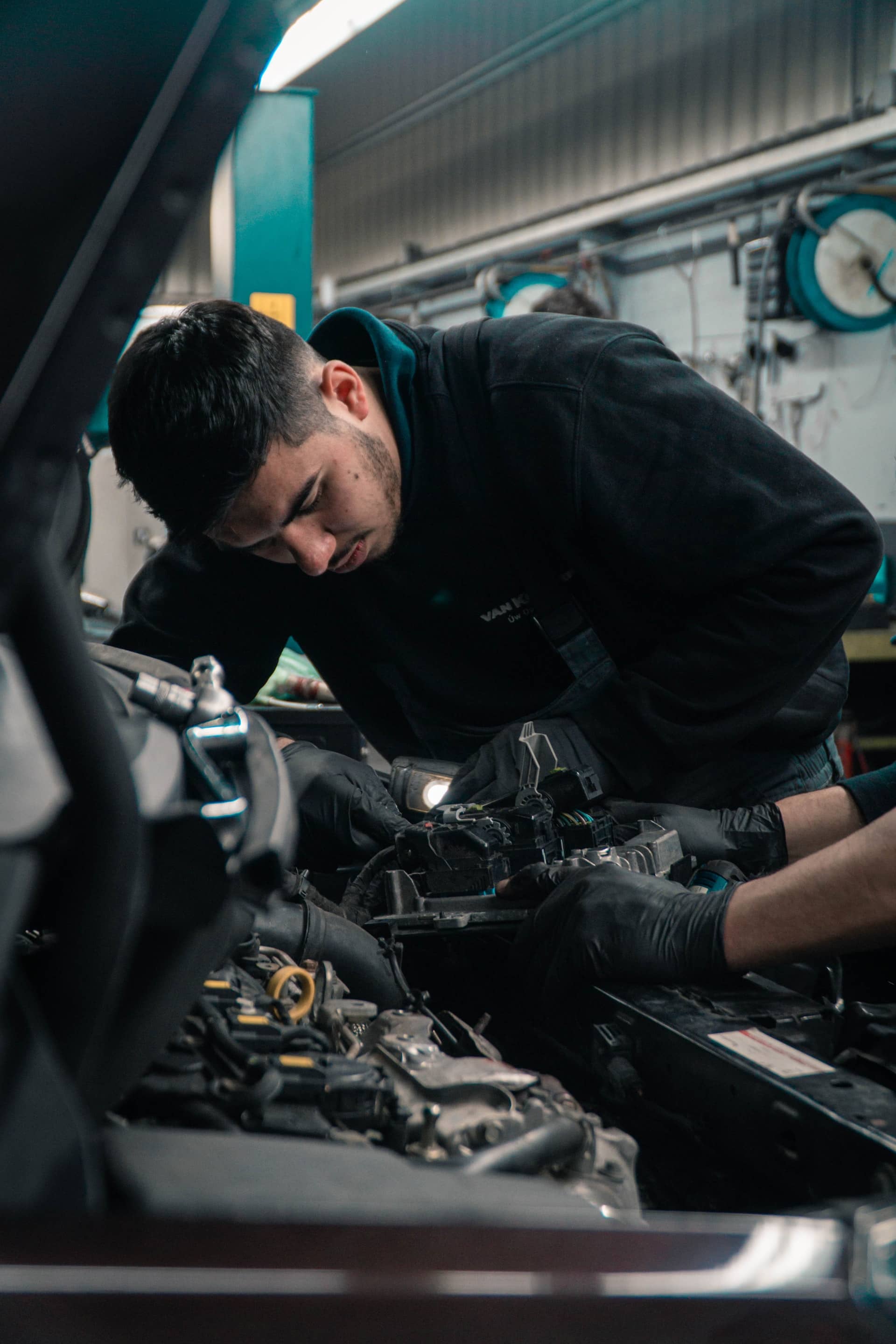 Technician repairing a car