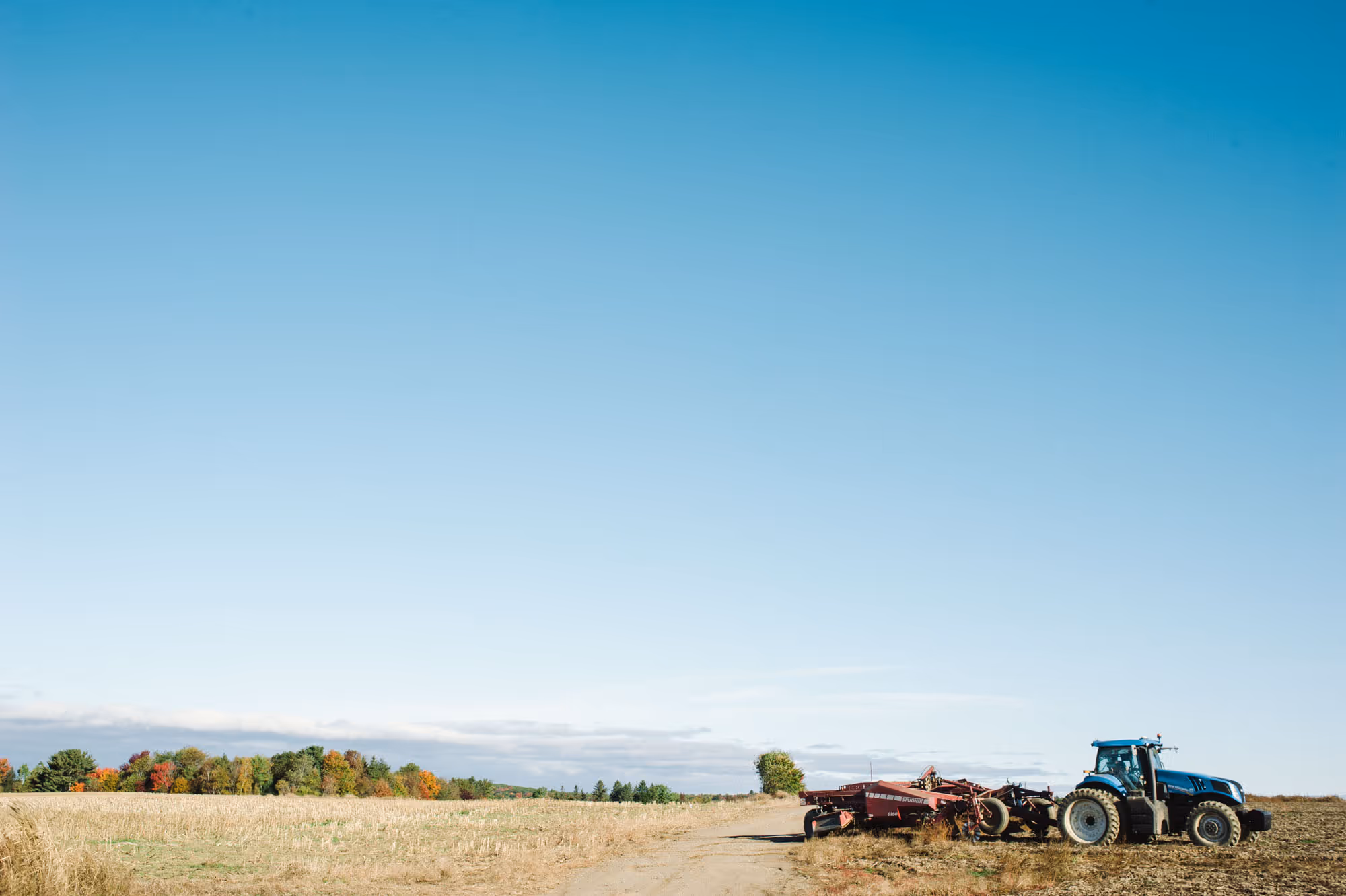 Tractor tilling a field