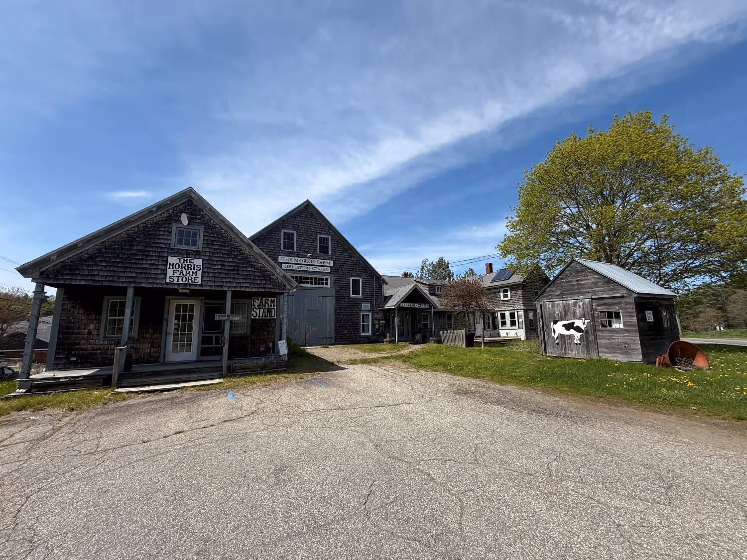 Historic Morris Farm with wooden buildings on a sunny spring day