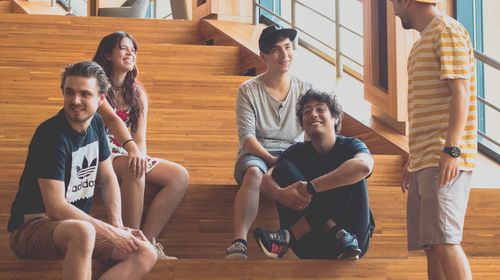 The Shelf team sitting a set of stairs