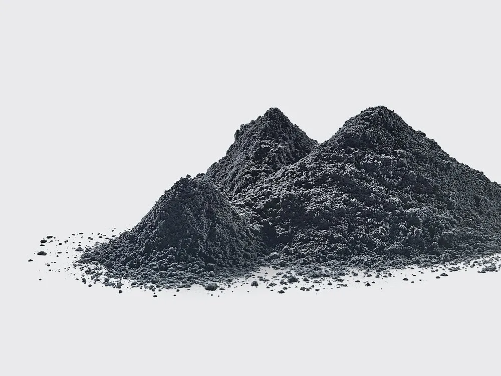 Graphite powder piled on a white surface