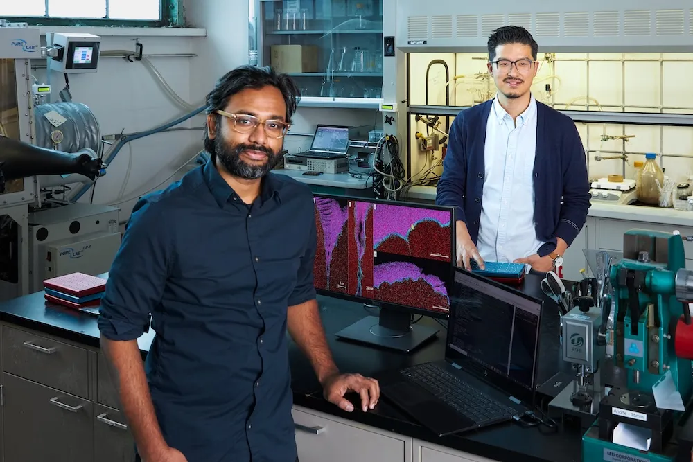 Two Coreshell team members in a battery laboratory