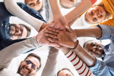 Employees hands together