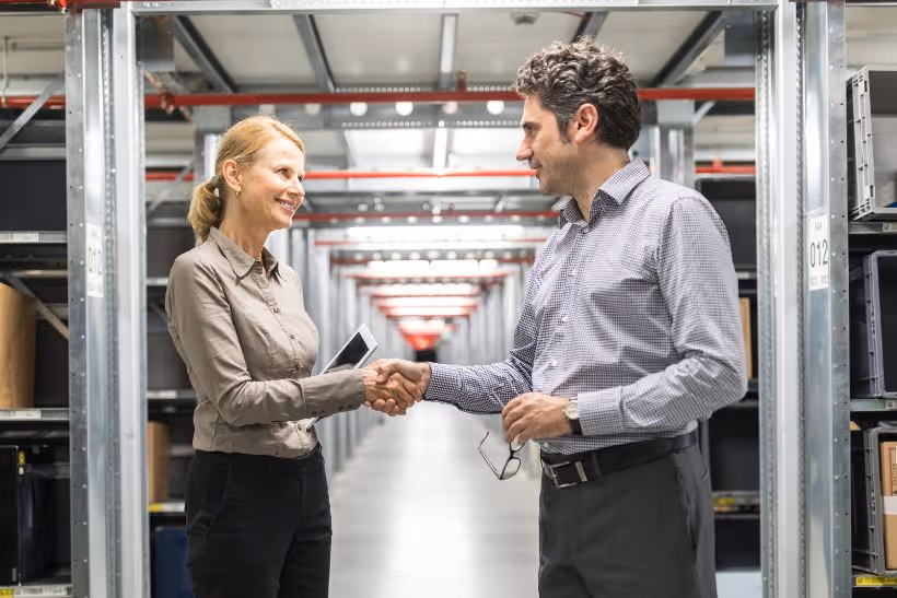 Creating a Pallet Sales Job Description - Two people shaking hands