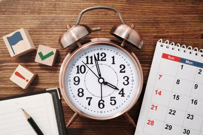 Clock, notes and a calendar - Time Management