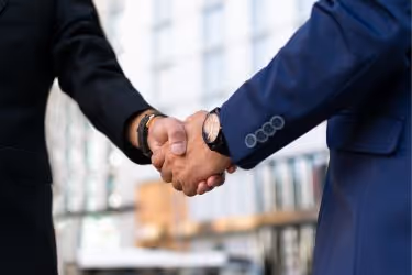 Two businessmen shaking hands