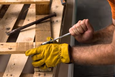 Someone inspecting wooden pallets